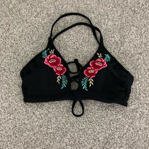 Black swimsuit top with embroidered roses